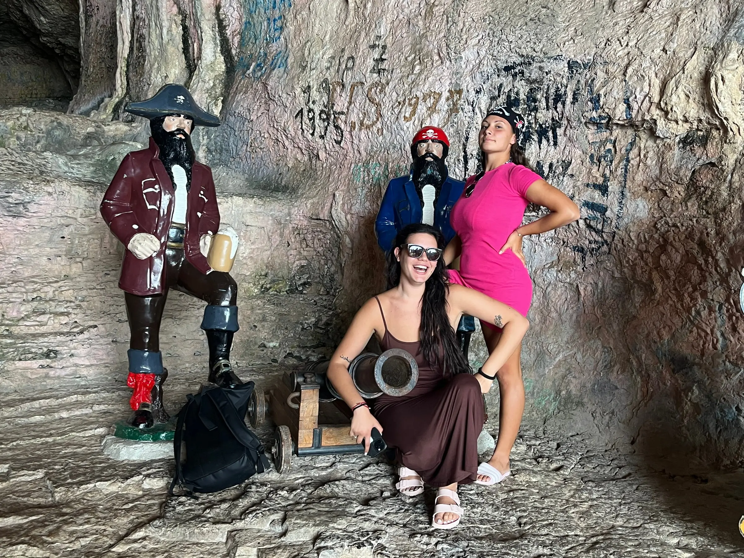Guests posing with the pirate statues at the Pirate Cave