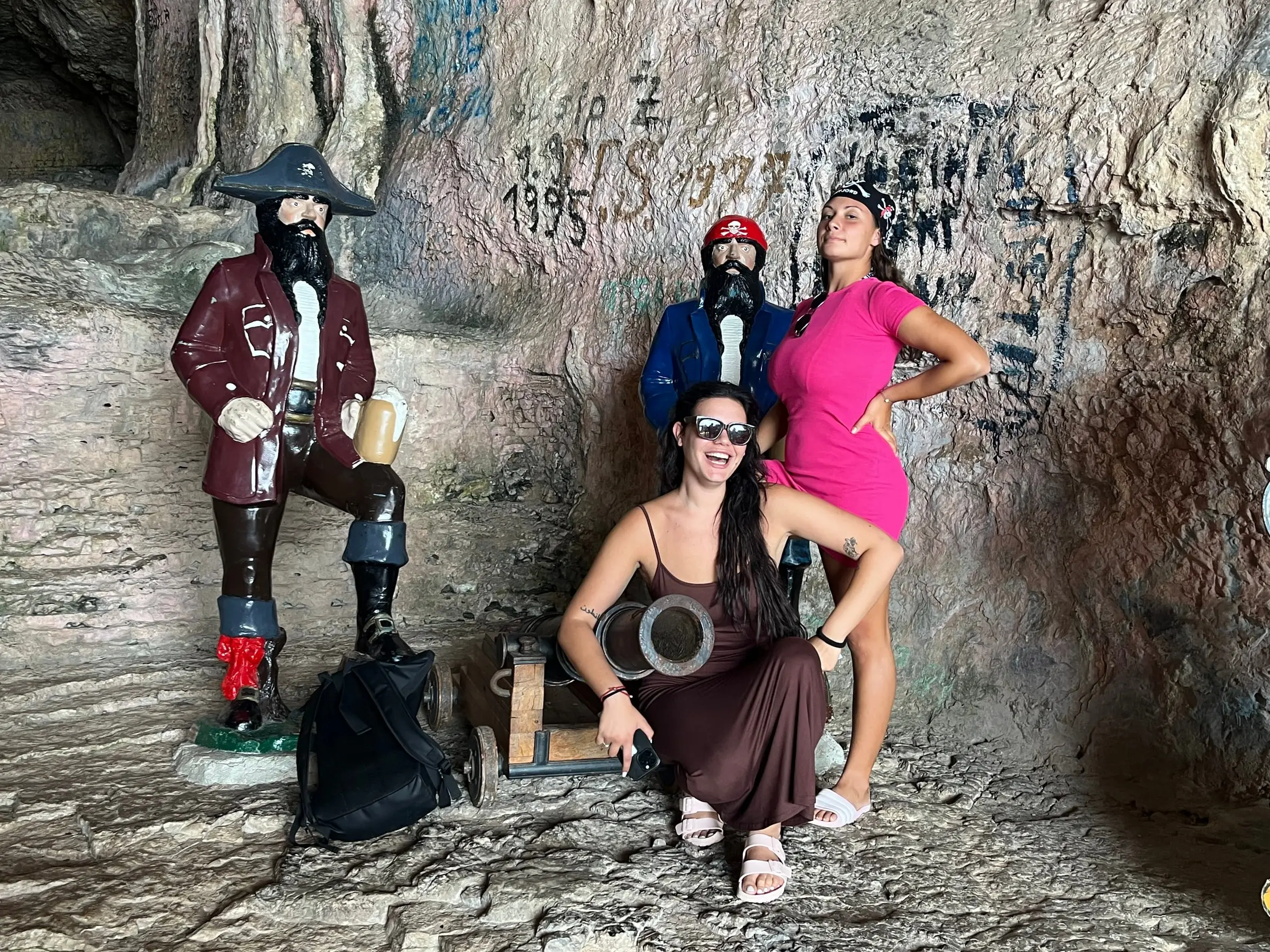 Guests posing with the pirate statues at the Pirate Cave